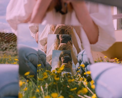 Reflection of a Woman on the Mirrors while Taking Photos Using a Dslr Camera 