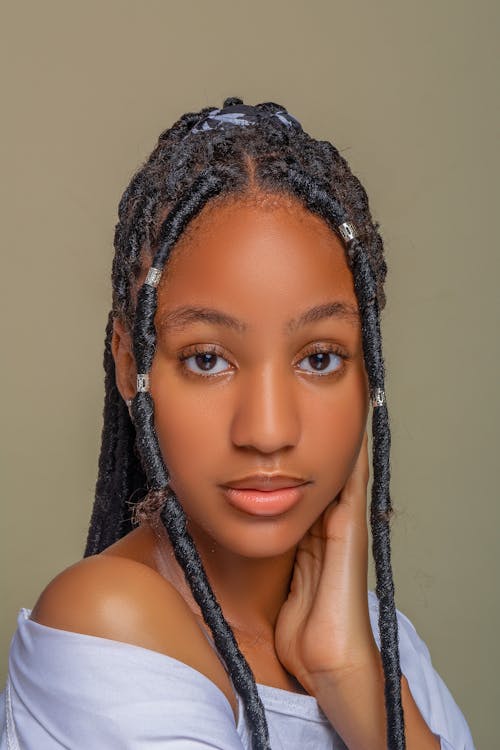 Portrait of a Beautiful Woman with Dreadlocks Looking at the Camera