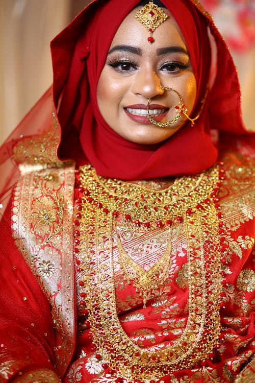 Photo of a Bride in a Red and Gold Sari Dress