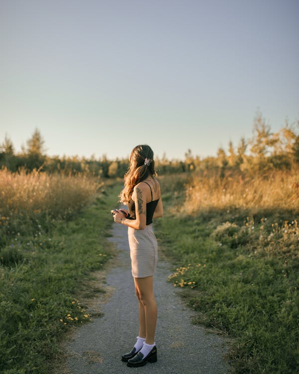 Woman on Footpath at Sunset