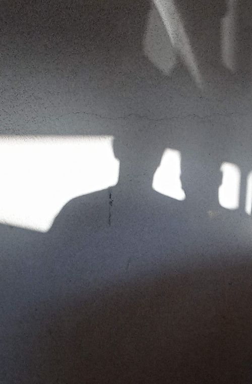 Free Creative photo of shadow silhouettes on a textured white wall, creating a mysterious ambience. Stock Photo