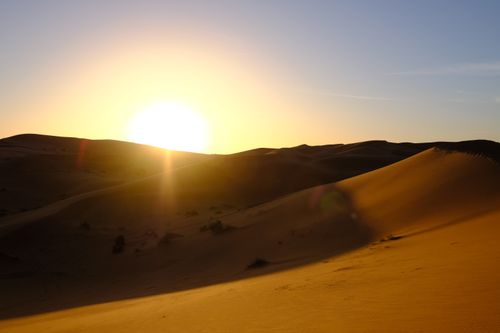 Free Beautiful sunrise over sand dunes in the Egyptian desert, New Valley Governorate. Stock Photo