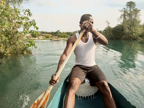 Free stock photo of african man, black man, blue lake