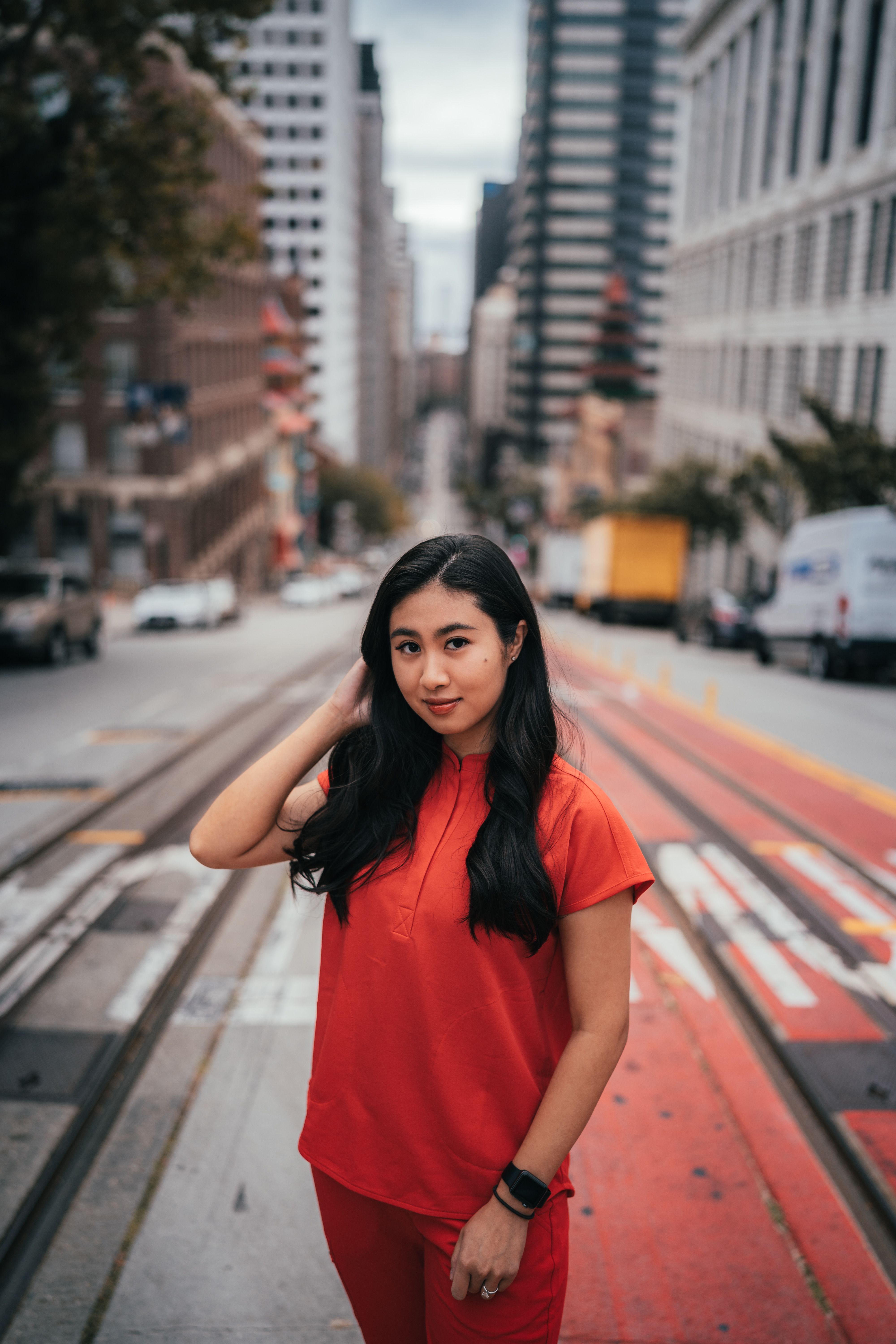 Portrait of Woman in Red Standing on City Street · Free Stock Photo
