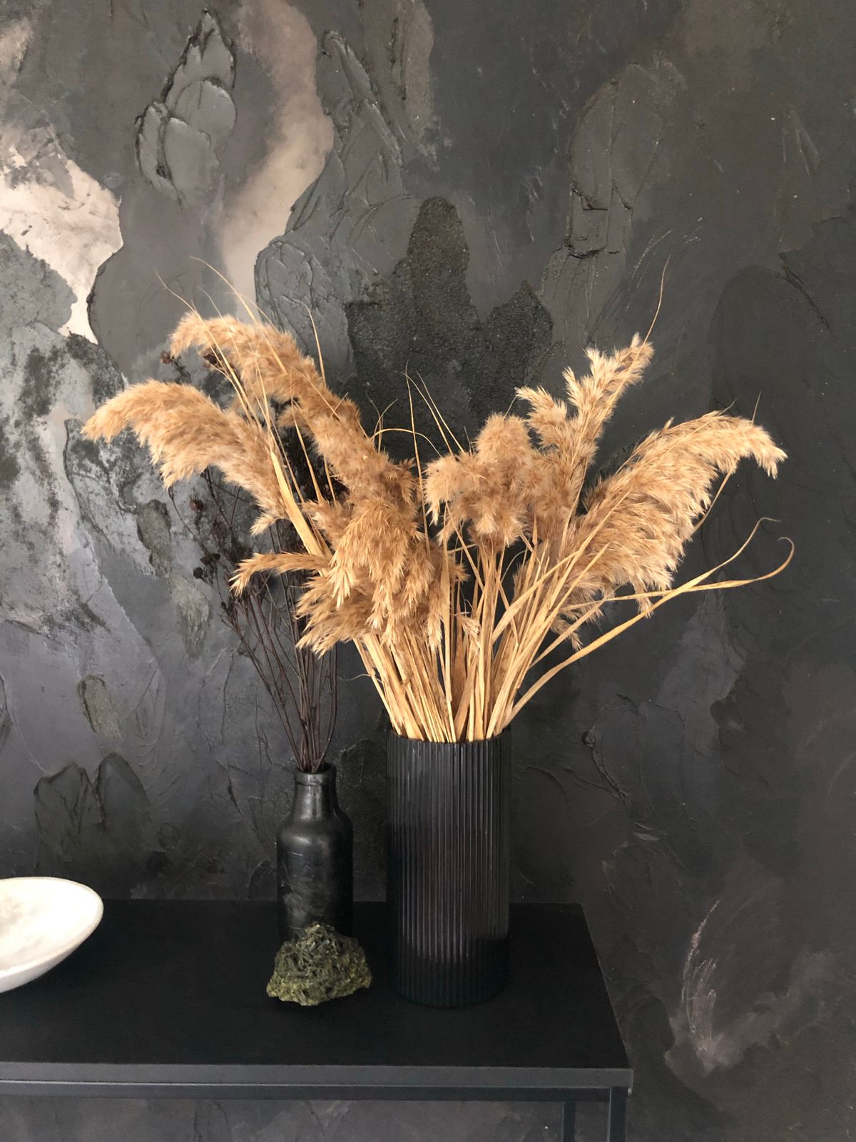 Dried smokebush stems in a black vase for a moody Thanksgiving look