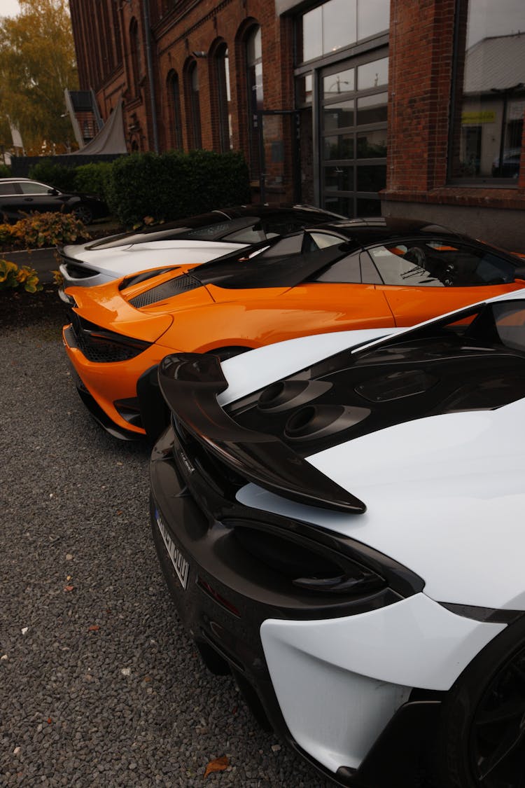 Supercars Parked Near A Building