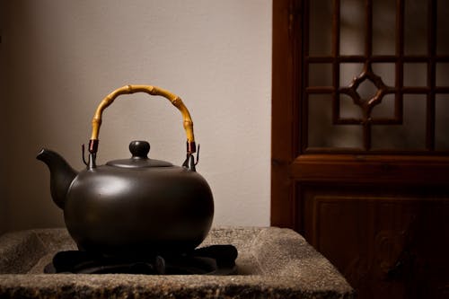 Free Unused Teapot on Side Table Stock Photo