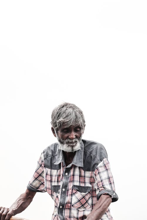Free An Elderly Man in Plaid Polo Shirt Stock Photo