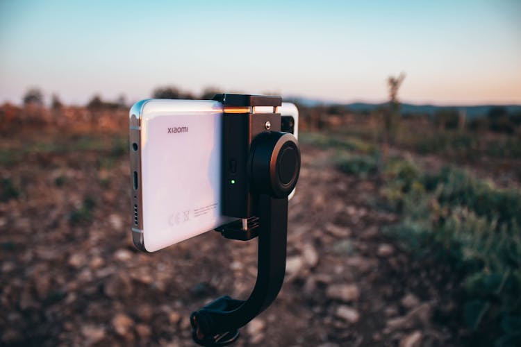 Modern Cellphone On Tripod In Nature