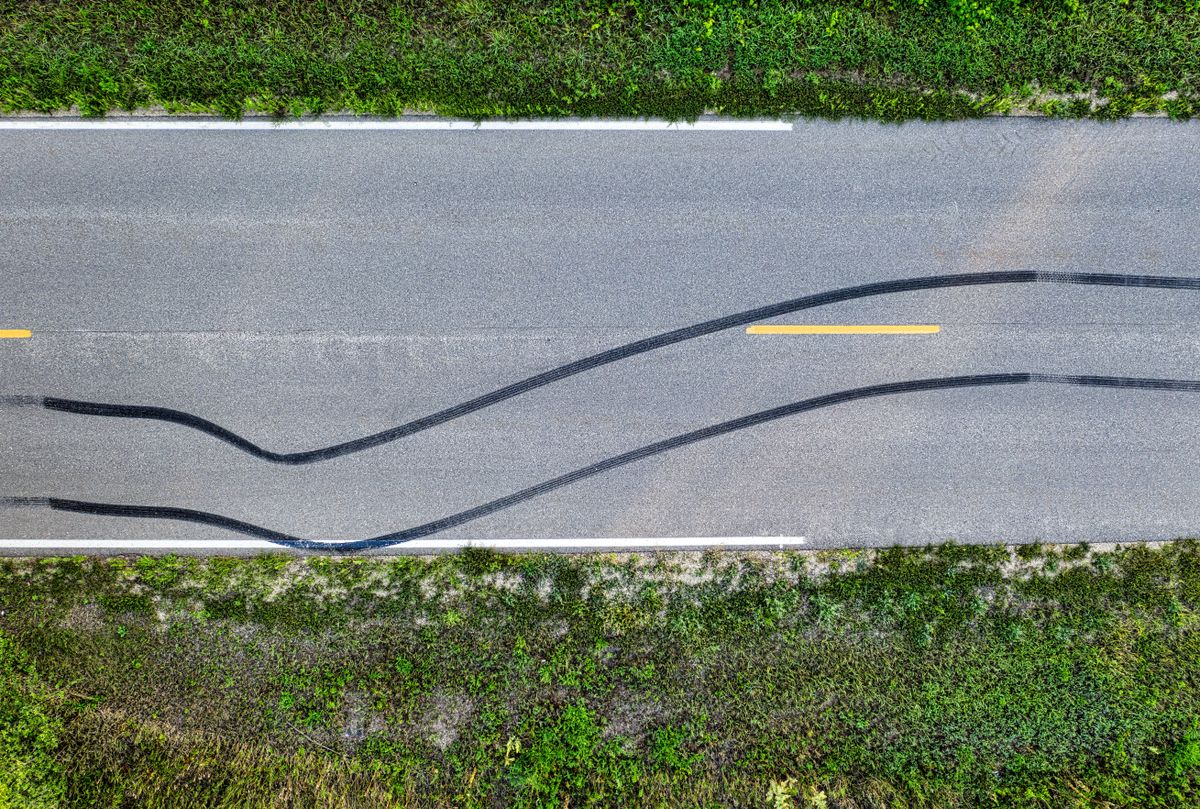 Truck tire skid marks on NJ highway asphalt