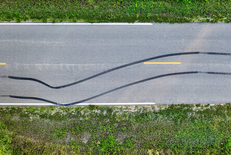 A Black Mark On The Asphalt Road