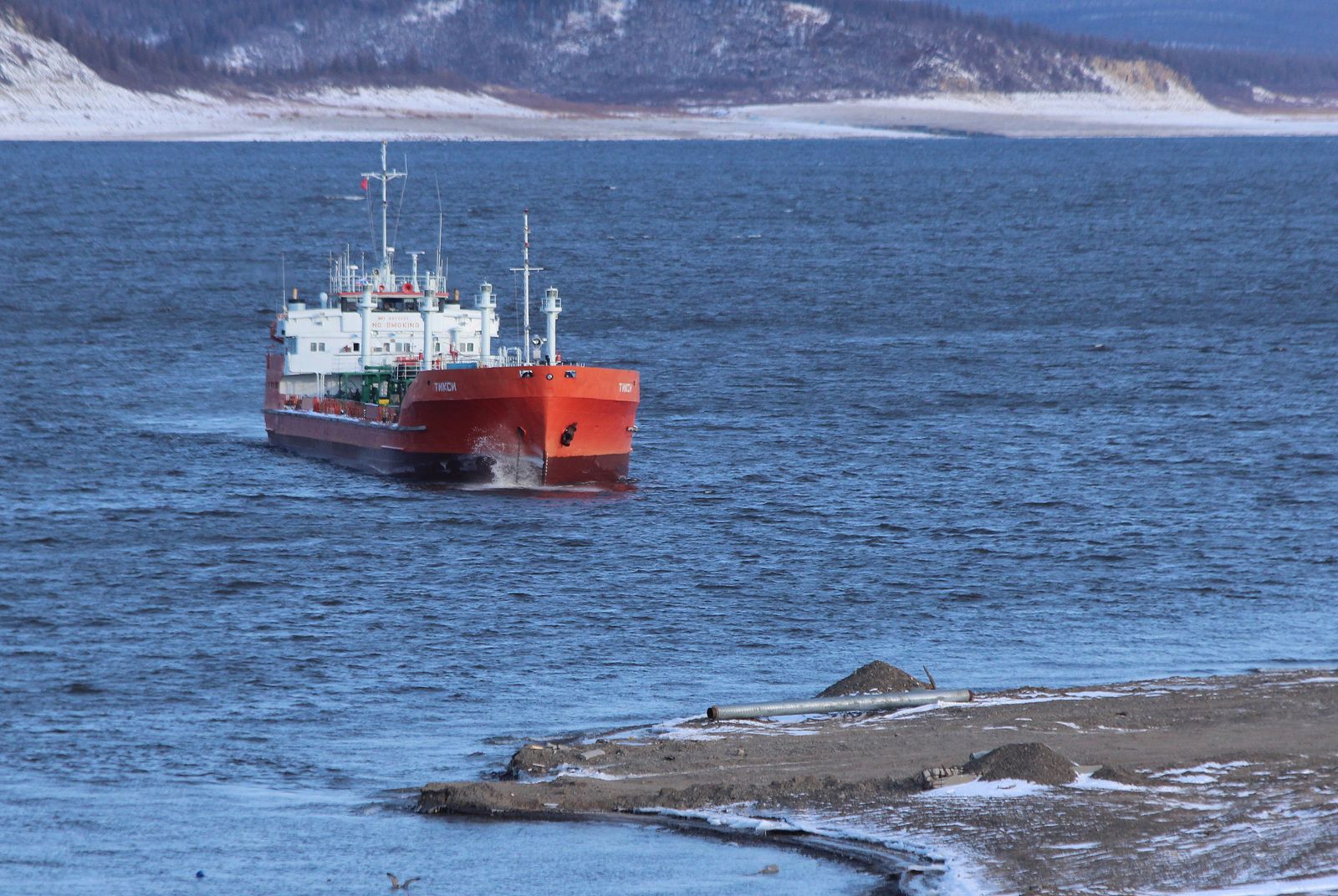 A large oil tanker photographed at sea, a scene that evokes the global energy supply chain running through chokepoints like the Strait of Hormuz.