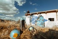 A Man Sitting on the Roof of an Abandoned Building