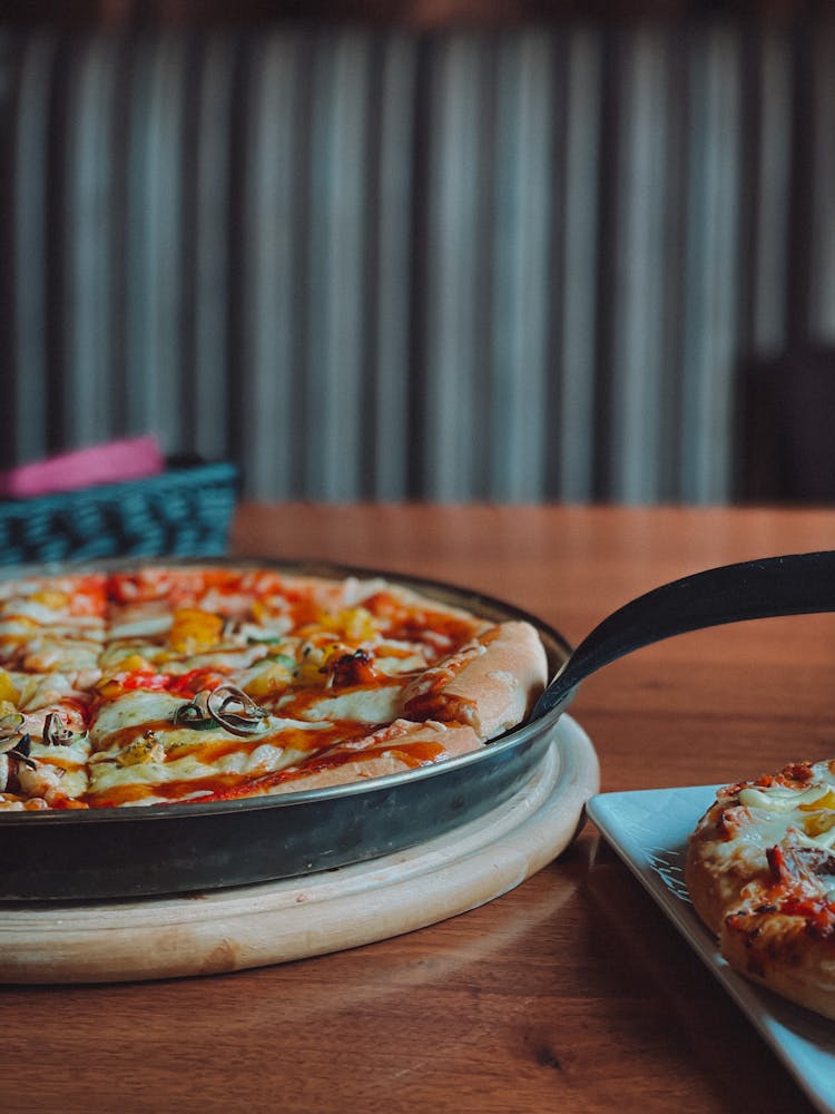 Pizza On Black Round Plate