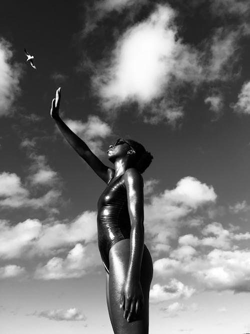 Free Woman in Black One Piece Swimsuit Looking Up Stock Photo