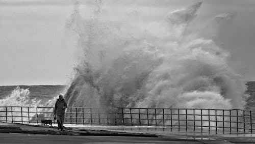 Big Waves Crashing on the Wooden Dock