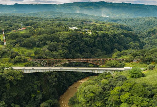 Aerial View of a Bridge Over a River i Green Mountains 