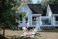 Two Women Arranging Decorations on an Outdoor Picnic Party