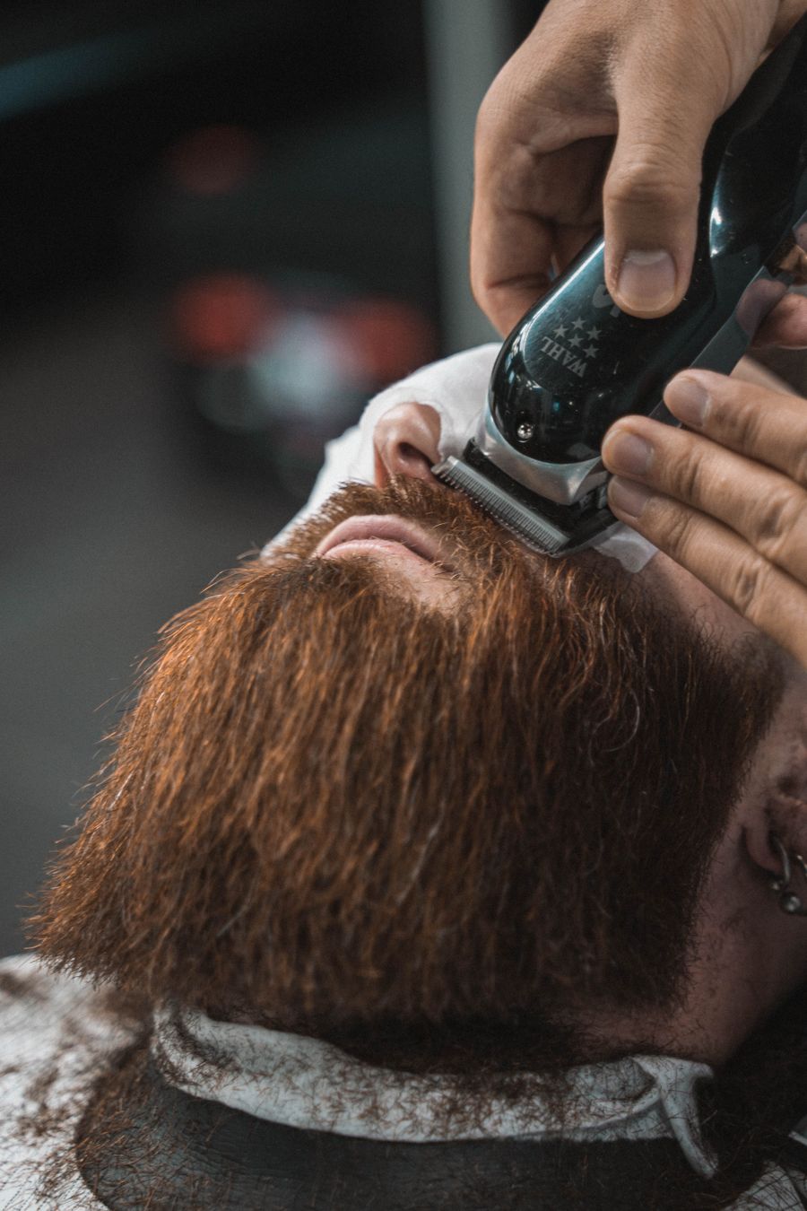 Close-up beard trimming at a barbershop