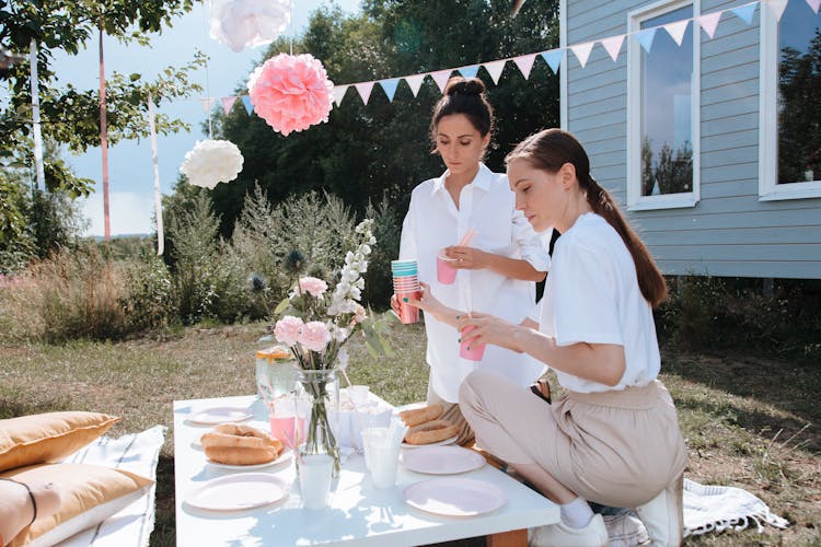 Women Preparing And Decorating For Party