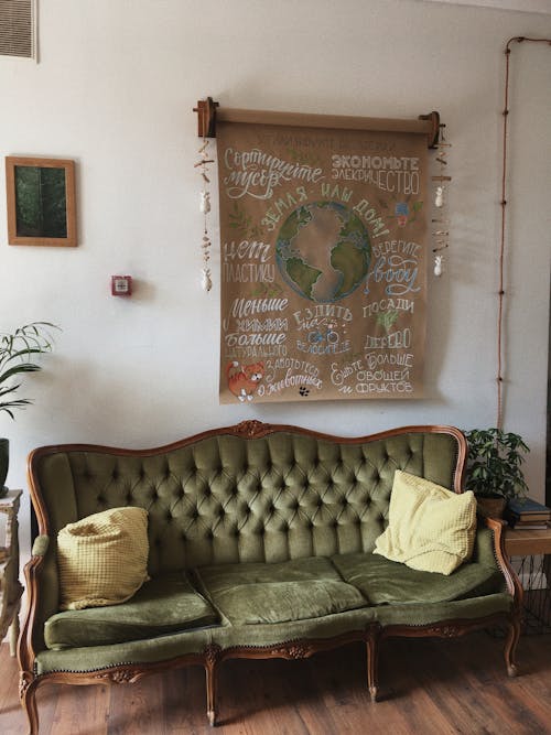 Free Throw Pillows on the Green Velvet Sofa Stock Photo
