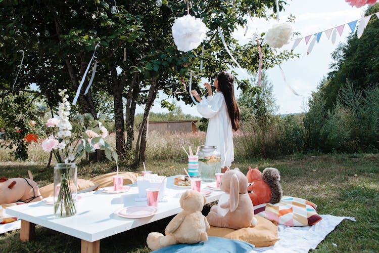 A Girl In White Dress At A Picnic Party