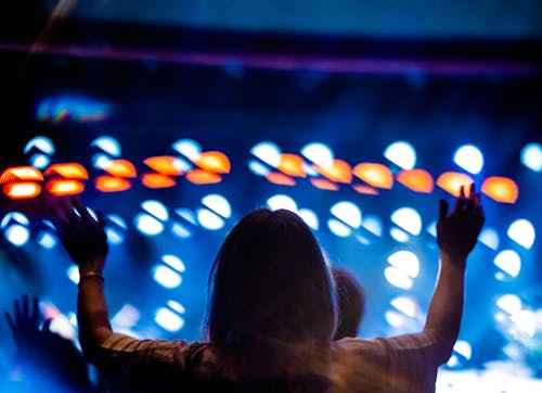 Back View of a Person Raising Her Hands