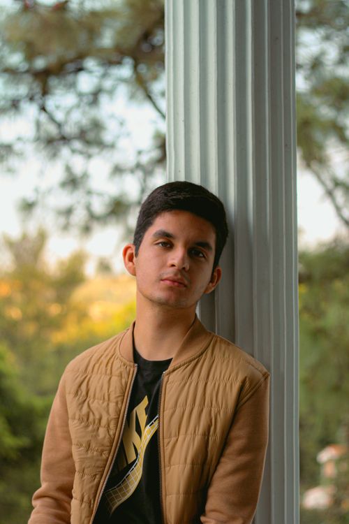 Free Casual portrait of a young man outdoors in a natural setting. Stock Photo