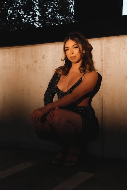 Woman Leaning on Concrete Fence