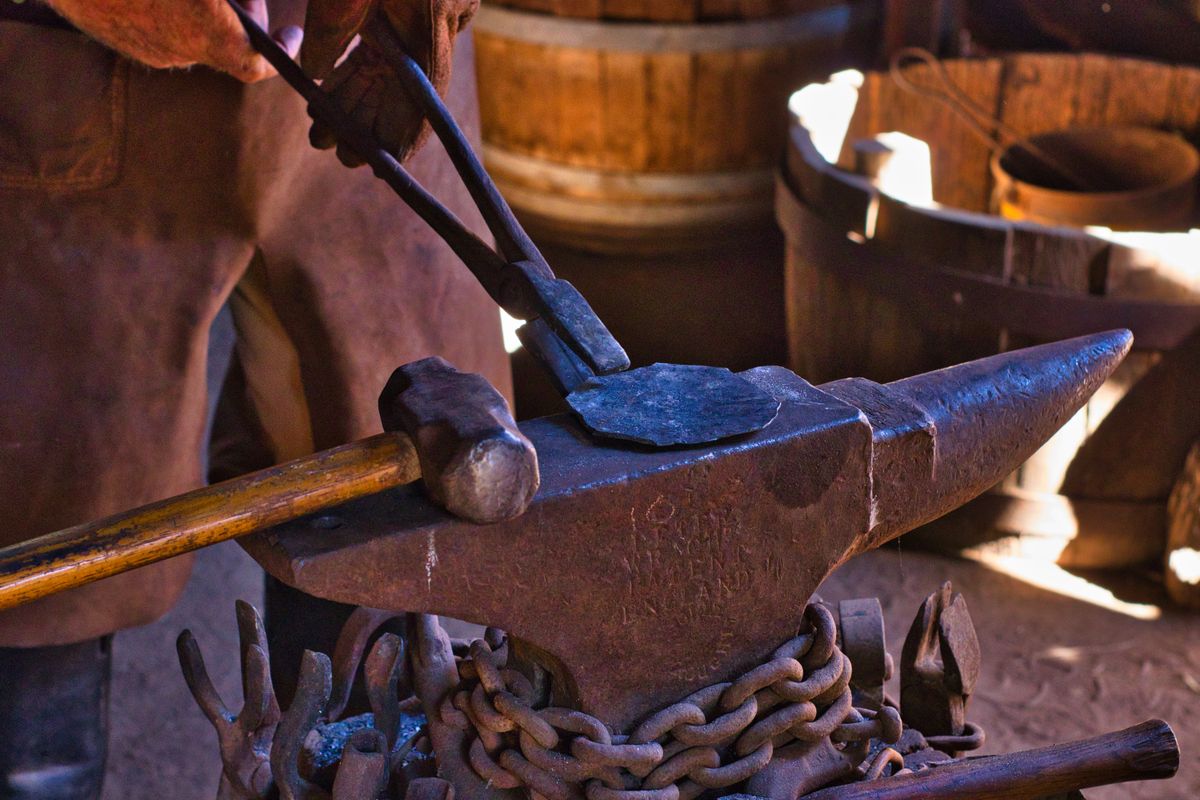 Close-up of fine leatherwork tools in a restoration workshop