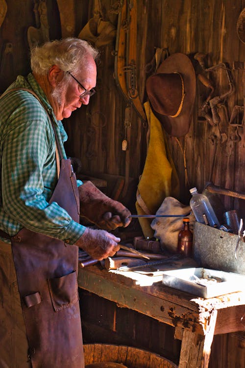 Elderly Man in a Workshop 