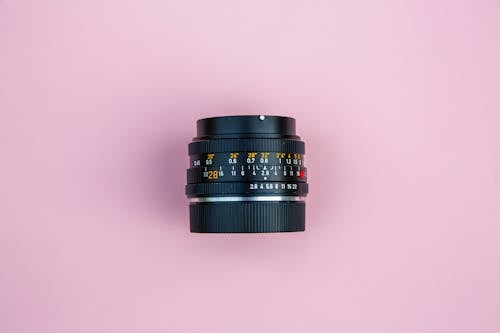 Free Black Camera Lens on Pink Surface Stock Photo