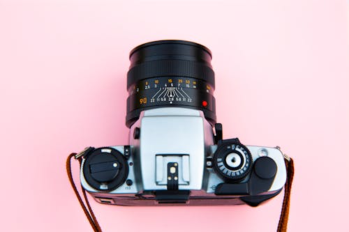 Free Black and Silver Camera on Brown Wooden Table Stock Photo