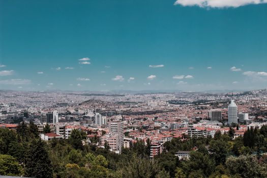 A stunning aerial view of Ankara, showcasing its modern urban landscape under a clear blue sky.