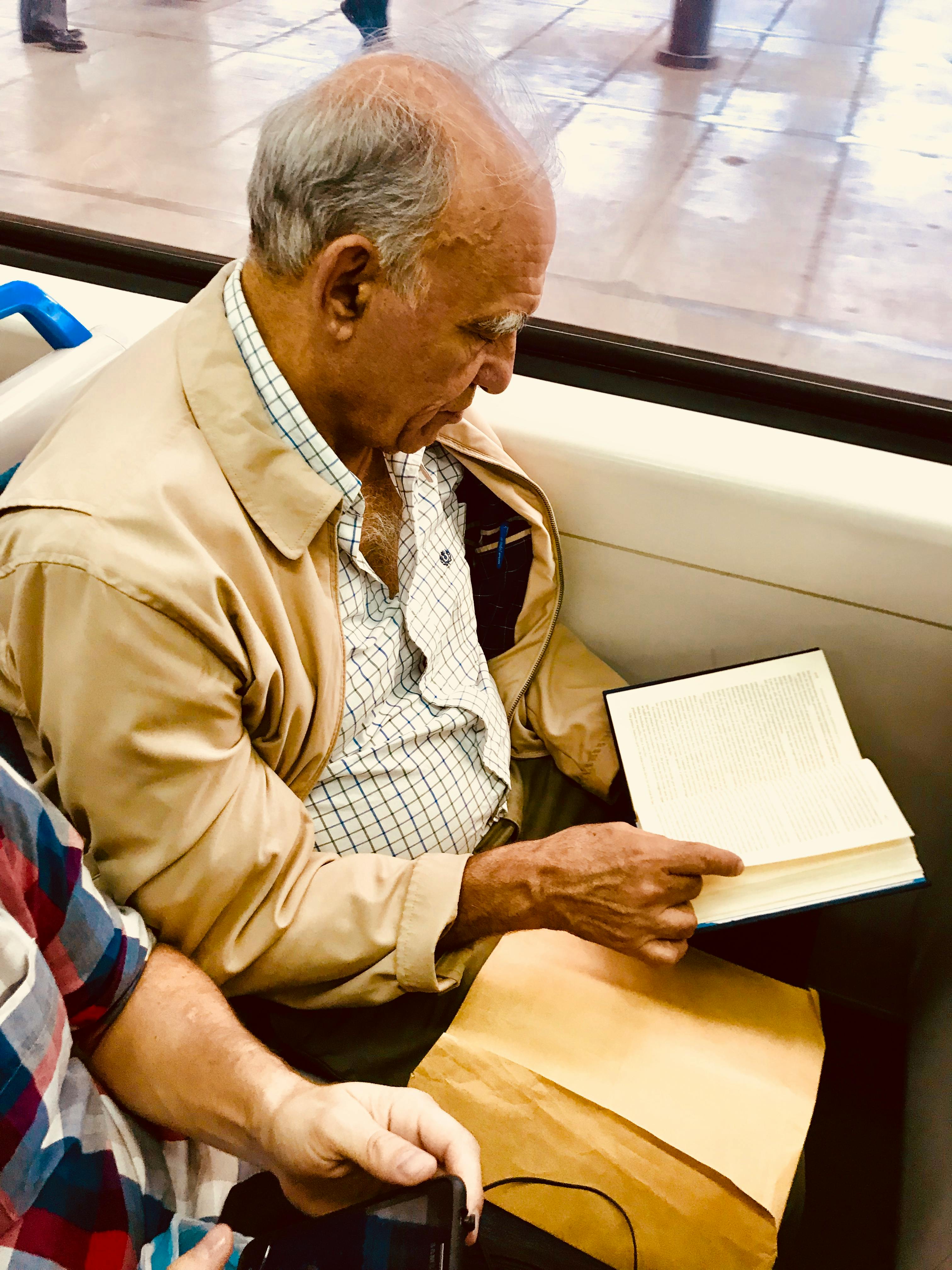 Free stock photo of book, old man, train