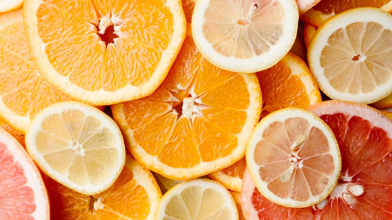 Fresh sliced oranges — natural source of vitamin C for skincare