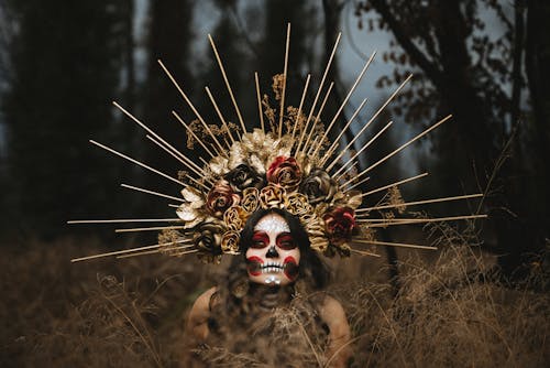 Free Portrait of Woman in Headdress and Face Painted for Day of the Dead Stock Photo