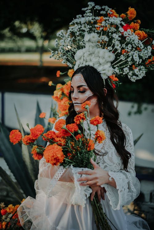 Free A Bride Wearing Halloween Make up and Holding Flowers Stock Photo