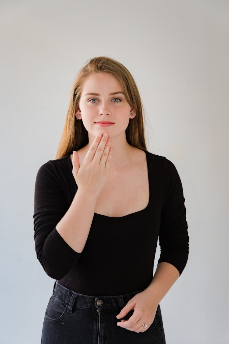 Portrait Of Woman Showing Sign Language