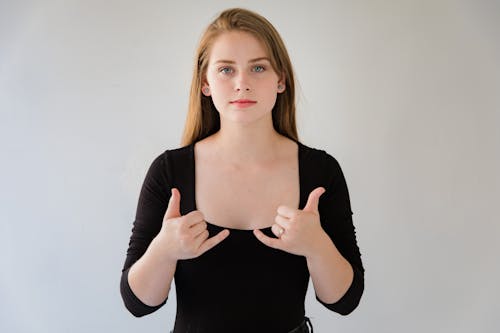 Free Portrait of Woman Showing Sign Language Stock Photo