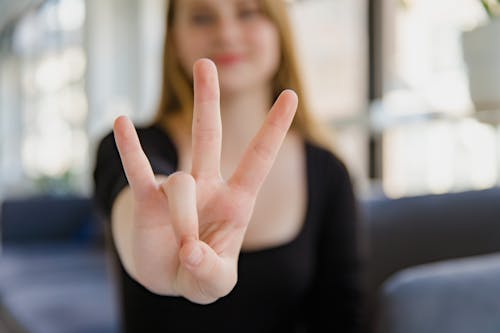 Close-up of Woman Showing Sign Language