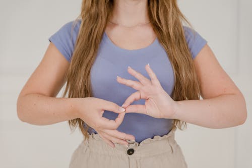 Close up on Womans Hands while Using Sign Language