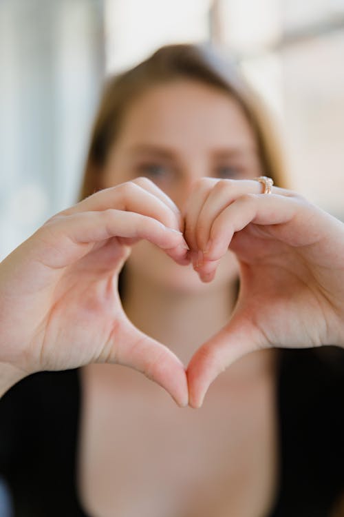 Close up on Heart Sign Done by Woman