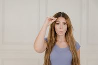 Portrait of Woman Showing Sign Language