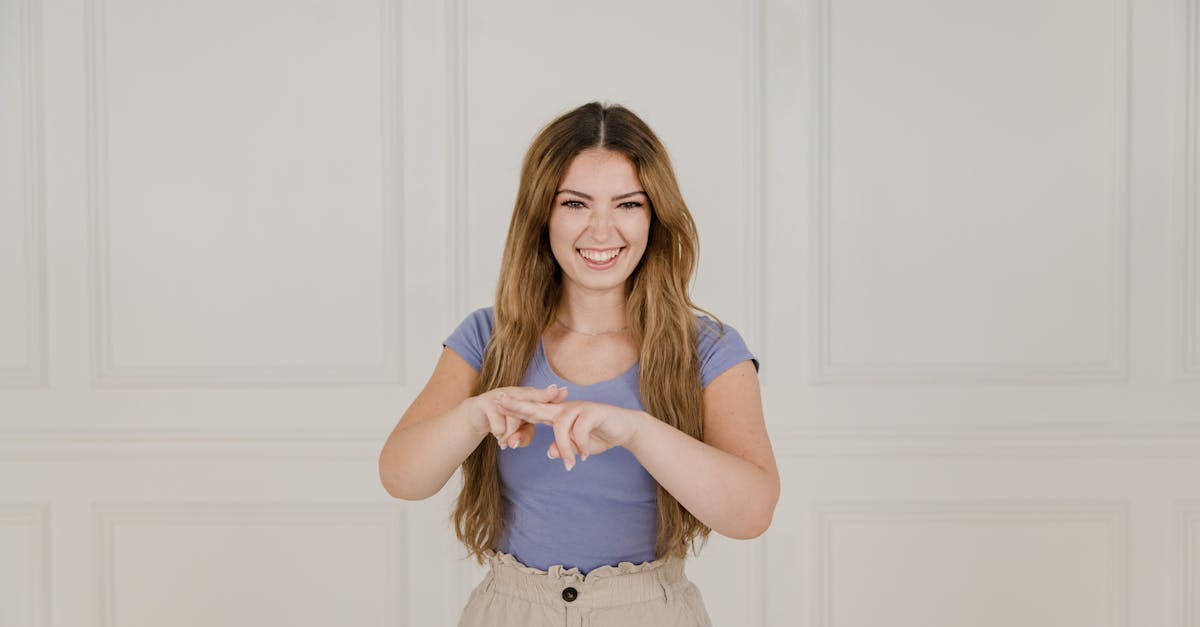 Portrait of Smiling Woman Showing Sign Language · Free Stock Photo