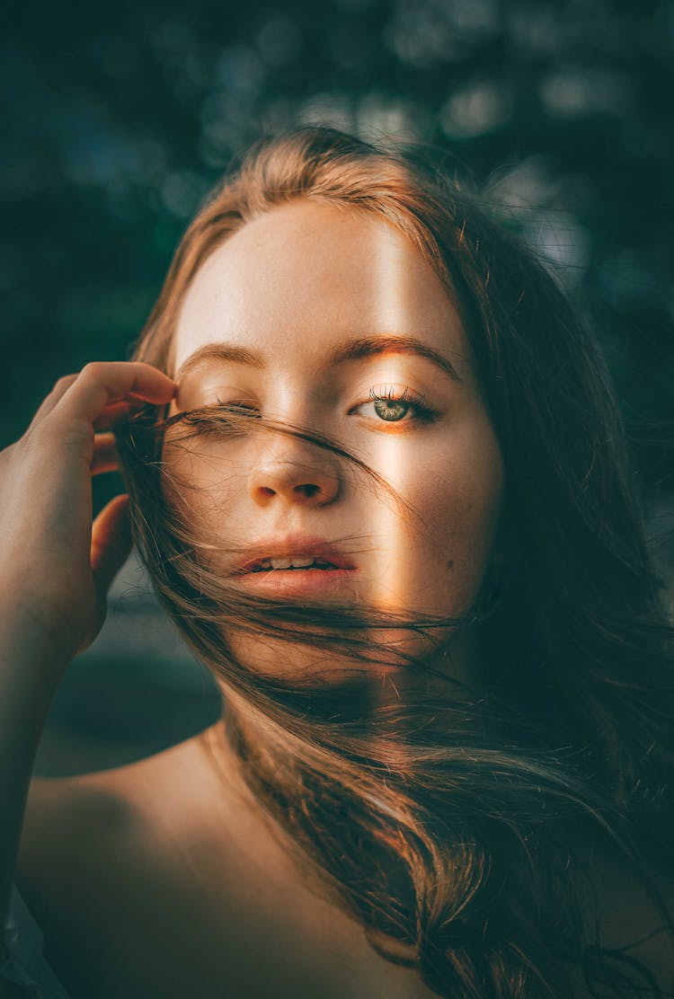 Woman With Hair Tousled In Wind