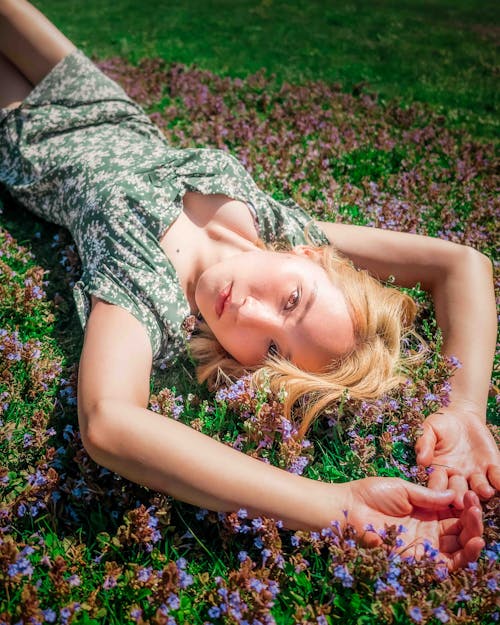 Woman in Green Dress Lying on Grass