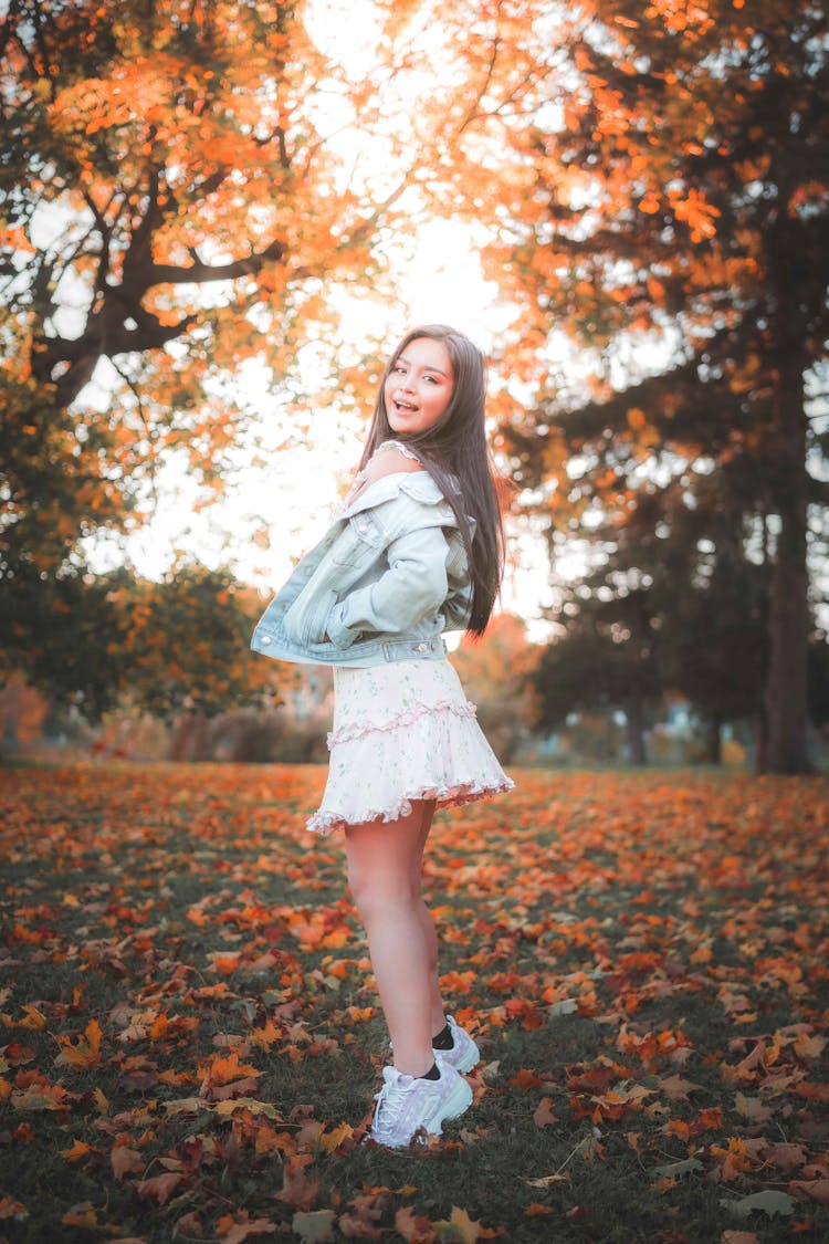 Woman Posing In Park In Autumn