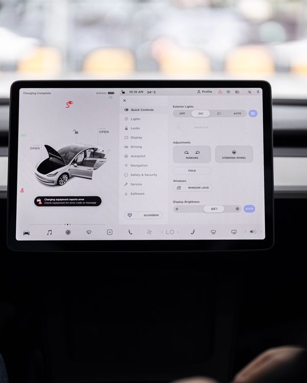 View of a modern car's dashboard featuring a digital display panel with control options.