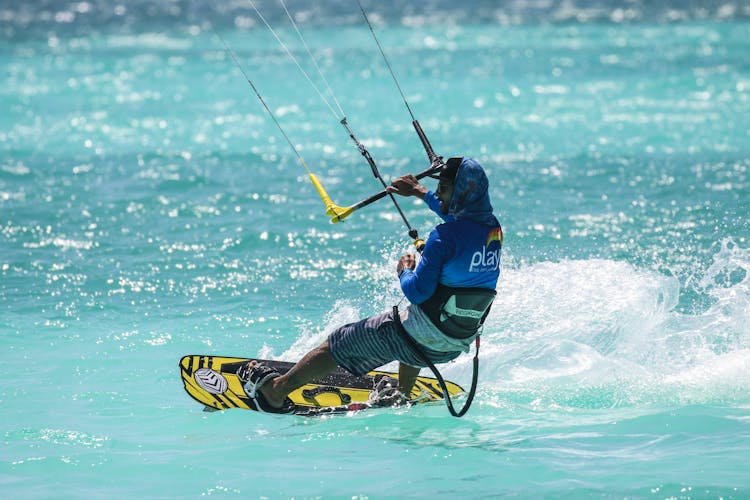 Man Kite Surfing In Blue Sea